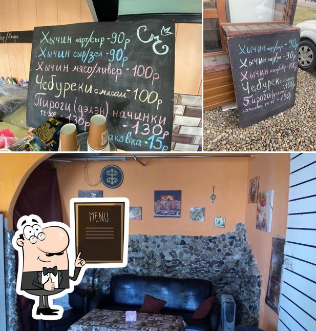Это фотография, где изображены доска для меню и внутреннее оформление в Балкарские хычины, кабардинские пироги