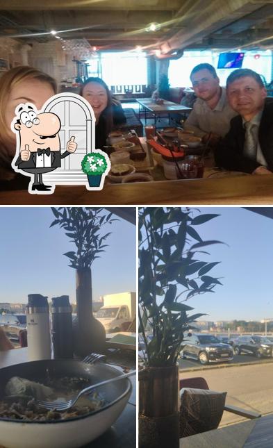 Изображение, на котором видны внешнее оформление и столики в Чабрец