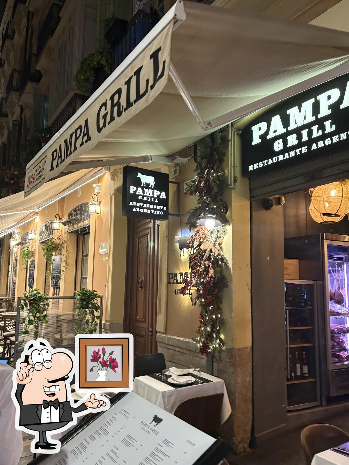 Посмотрите на внутренний интерьер "Pampa Grill Parrilla y carnes argentinas Málaga Centro".