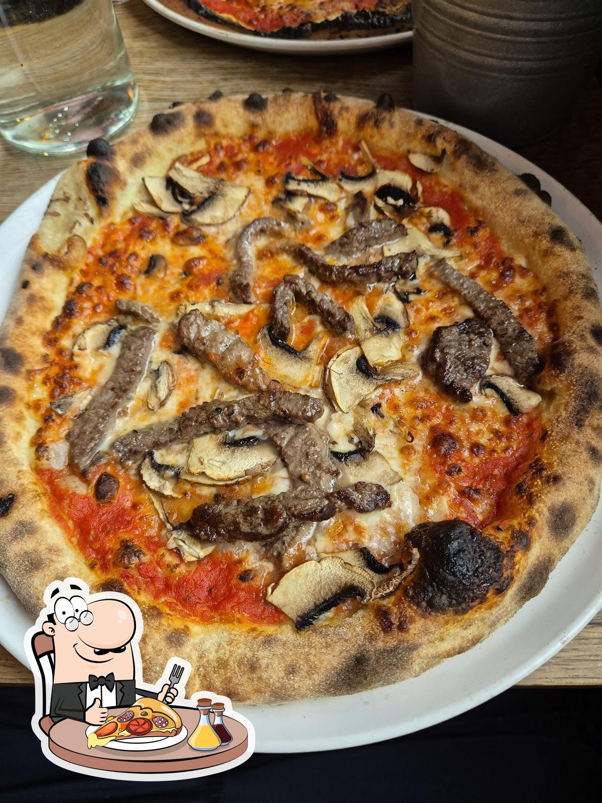  Закажите  пиццу в "Strip Joint Glasgow : Cold Beer, Pizza, Vinyl Records".