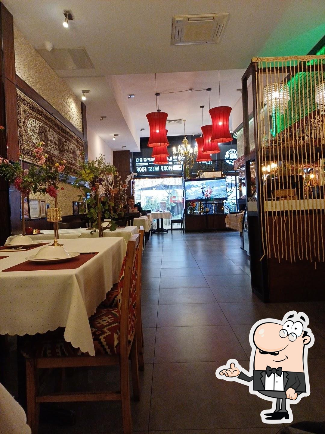 Посмотрите на внутренний интерьер "Kroren Restaurant (Loulan Xinjiang)".