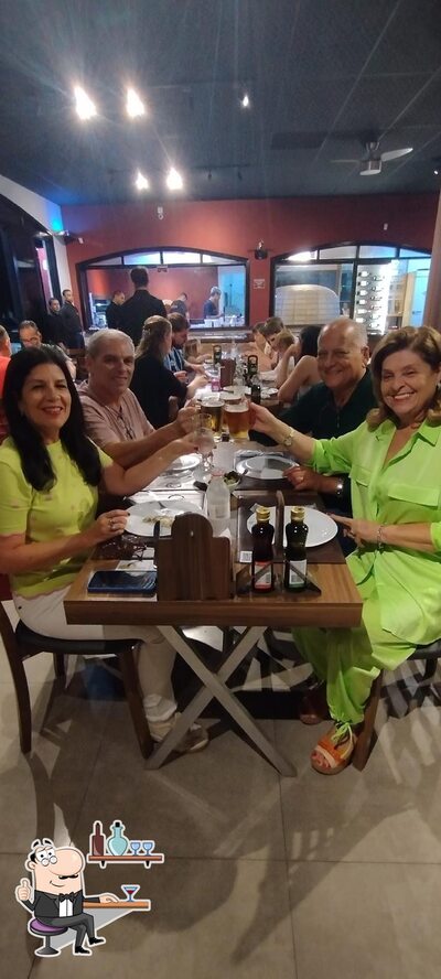 O interior do Manggiare Pizzaria Express