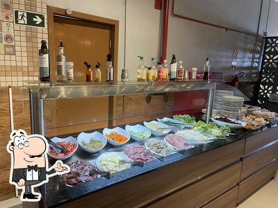 Sente em uma das mesas no Da Terra Produtos Coloniais