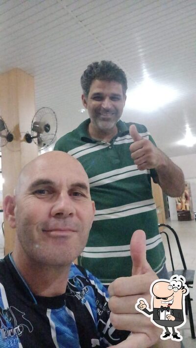 Sente em uma das mesas no Churrascaria Mococão