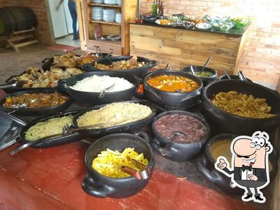 O interior do Restaurante Rancho Paiol